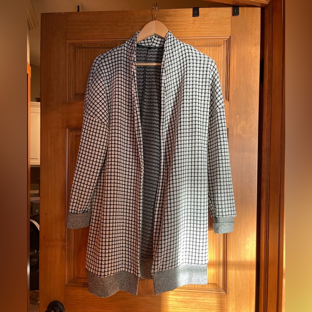 Black & white checkered sweater coat.